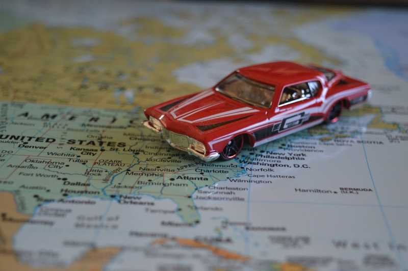 Toy car on top of a map