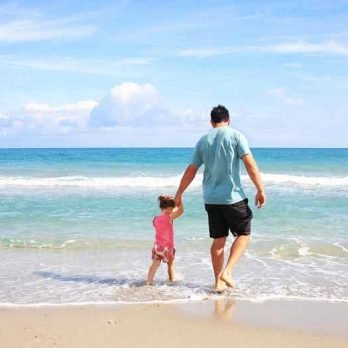 Father with his daughter on a beach