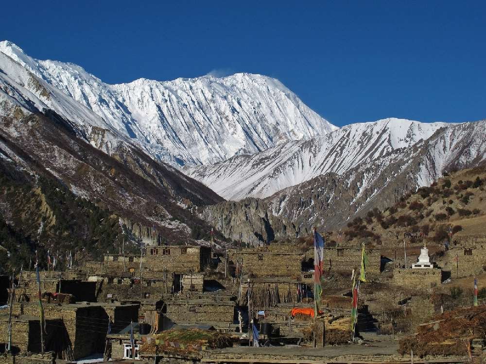 bigstock-Khangsar-and-snow-capped-Tilic