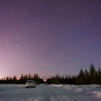 Sustainable car on snowy road in Rovaniemi (Finland)