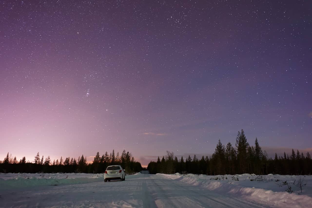 Sustainable car on snowy road in Rovaniemi (Finland)