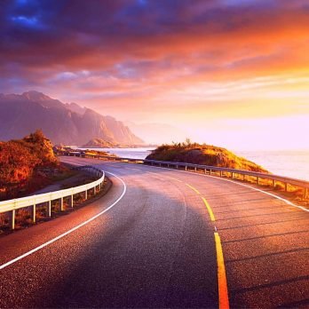 Road by the sea at sunrise time on Lofoten Island (Norway)