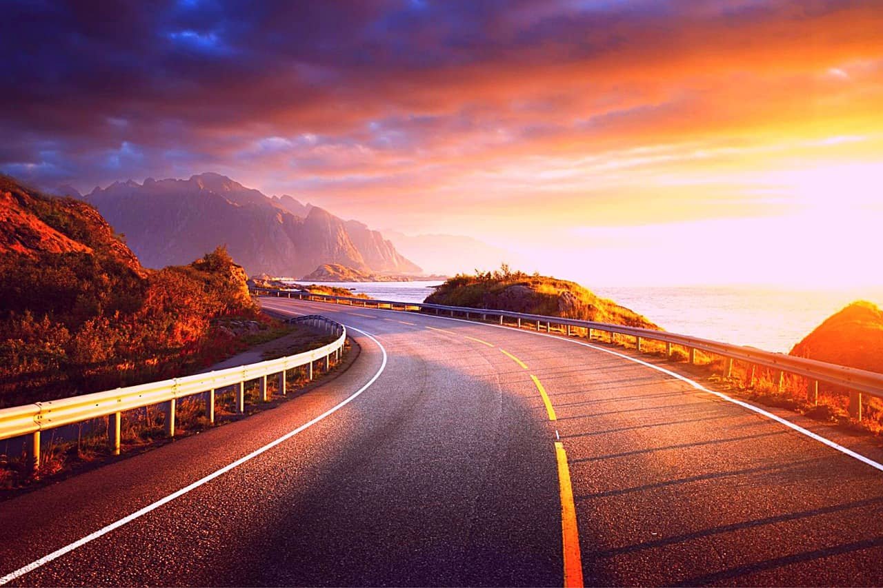 Road by the sea at sunrise time on Lofoten Island (Norway)